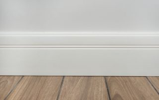 light,matte,wall,,white,baseboard,and,tiles,immitating,hardwood,flooring