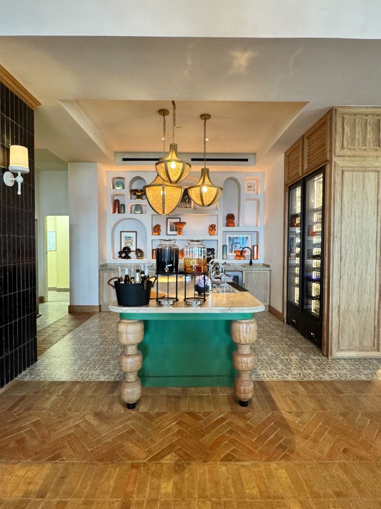 Photo credit: MetaphorDesign.com Location: Service Island, The Four Seasons, Cabo San Lucas, Mexico Moulding Highlights: Wood baseboard, painted wood trim at island, wood clad ceiling beams, wood trim at end panel, wood cornice at top of column, wood trim at panelling