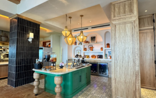 Photo credit: MetaphorDesign.com Location: Service Island, The Four Seasons, Cabo San Lucas, Mexico Moulding Highlights: Wood baseboard, painted wood trim at island, wood clad ceiling beams, wood trim at end panel, wood cornice at top of column, wood trim at panelling