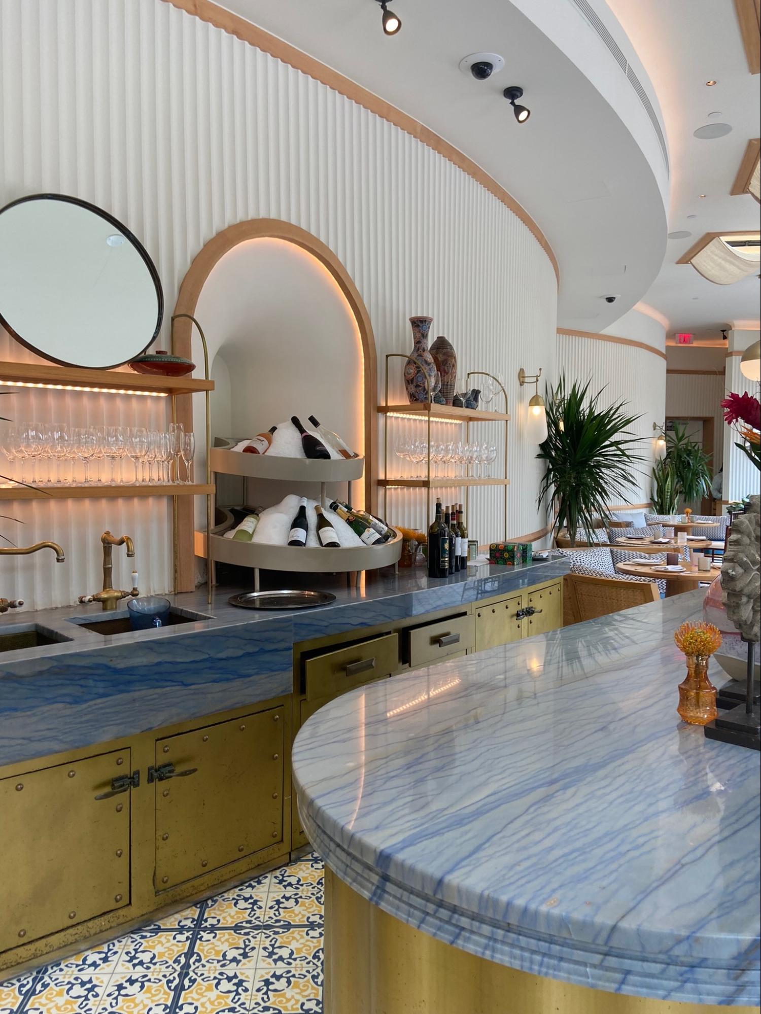 Location: Hospitality Project, Wood Highlights: Trim at S4S shelving with fluted wood at back