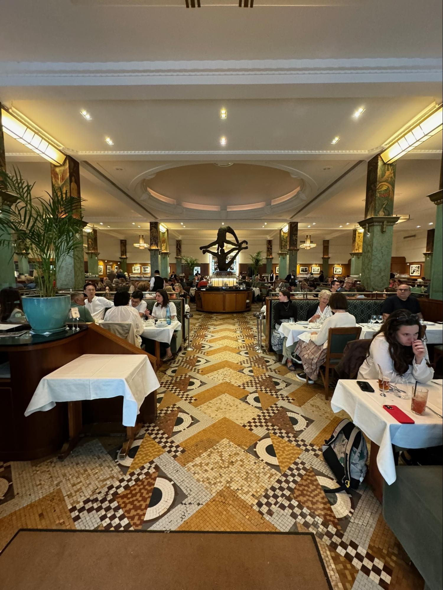 Location: La Coupole, Paris, France Wood Highlights: Trim at ceiling placed to frame recessed lighting