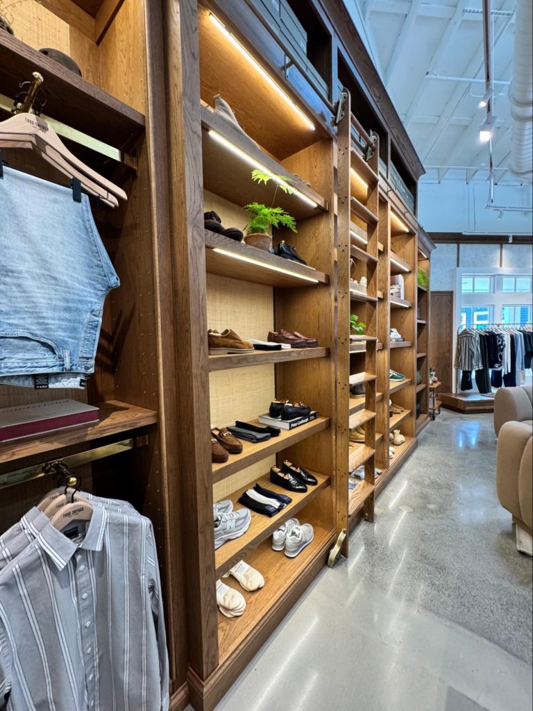 Location: Todd Snyder, Marin County, CaliforniaWood Highlights: Flat eased edge moulding at edge of S4S shelving at front and back with wallcovering fabric, offset edges, and crown moulding above.