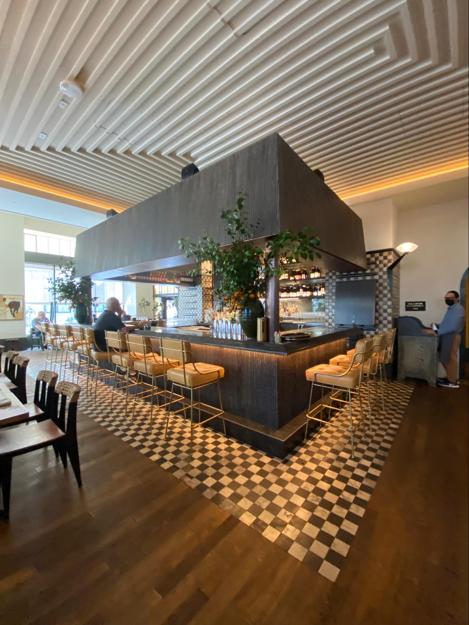 Location: Caldo Verde Restaurant, Los Angeles, California Wood Highlights: Trim at ceiling placed to highlight inset and provide for recessed lighting
