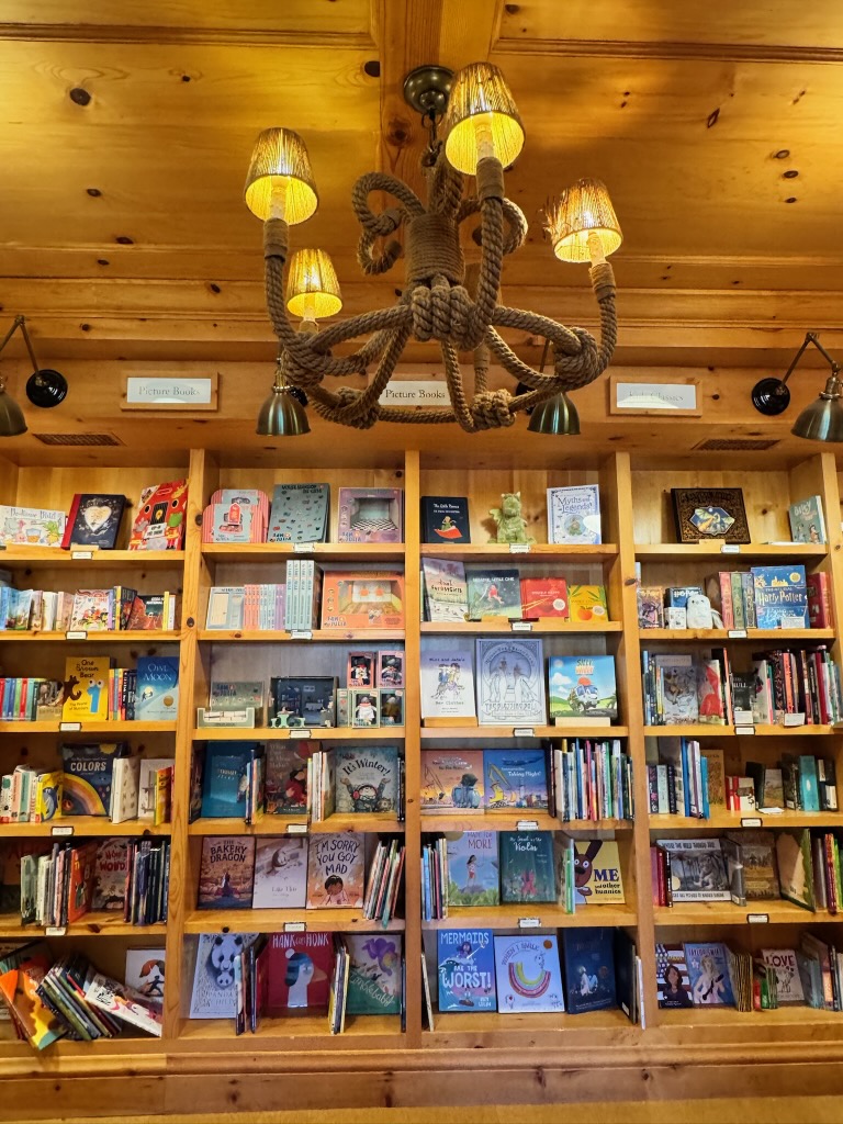 Location: Copperfield Books, Marin County, California, Wood Highlights: Knotty pine trim at shelving and at crown and base