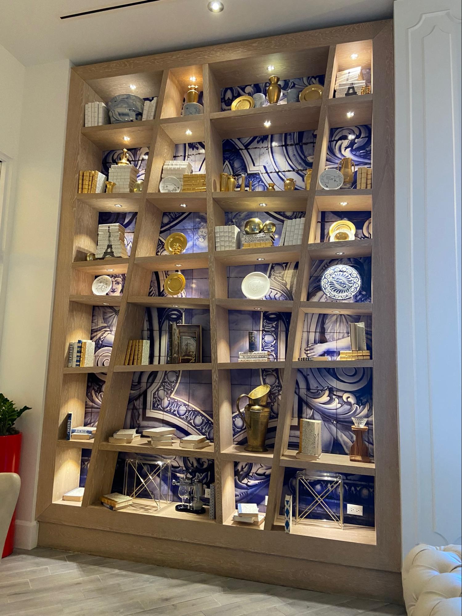 Location: Cafe Madeleine at Baha Mar, Wood Highlights: S4S horizontally and vertically placed, butted, framed at the perimeter and mitered, with baseboard moulding, and a tiled back wall