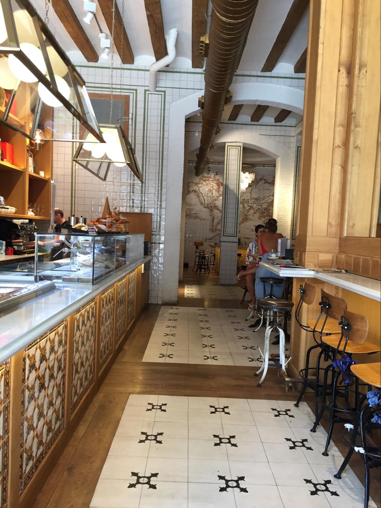 Location: Restaurant and Cafe, Barcelona, Spain, Wood Highlights: White oak wood flooring bordering tile fields