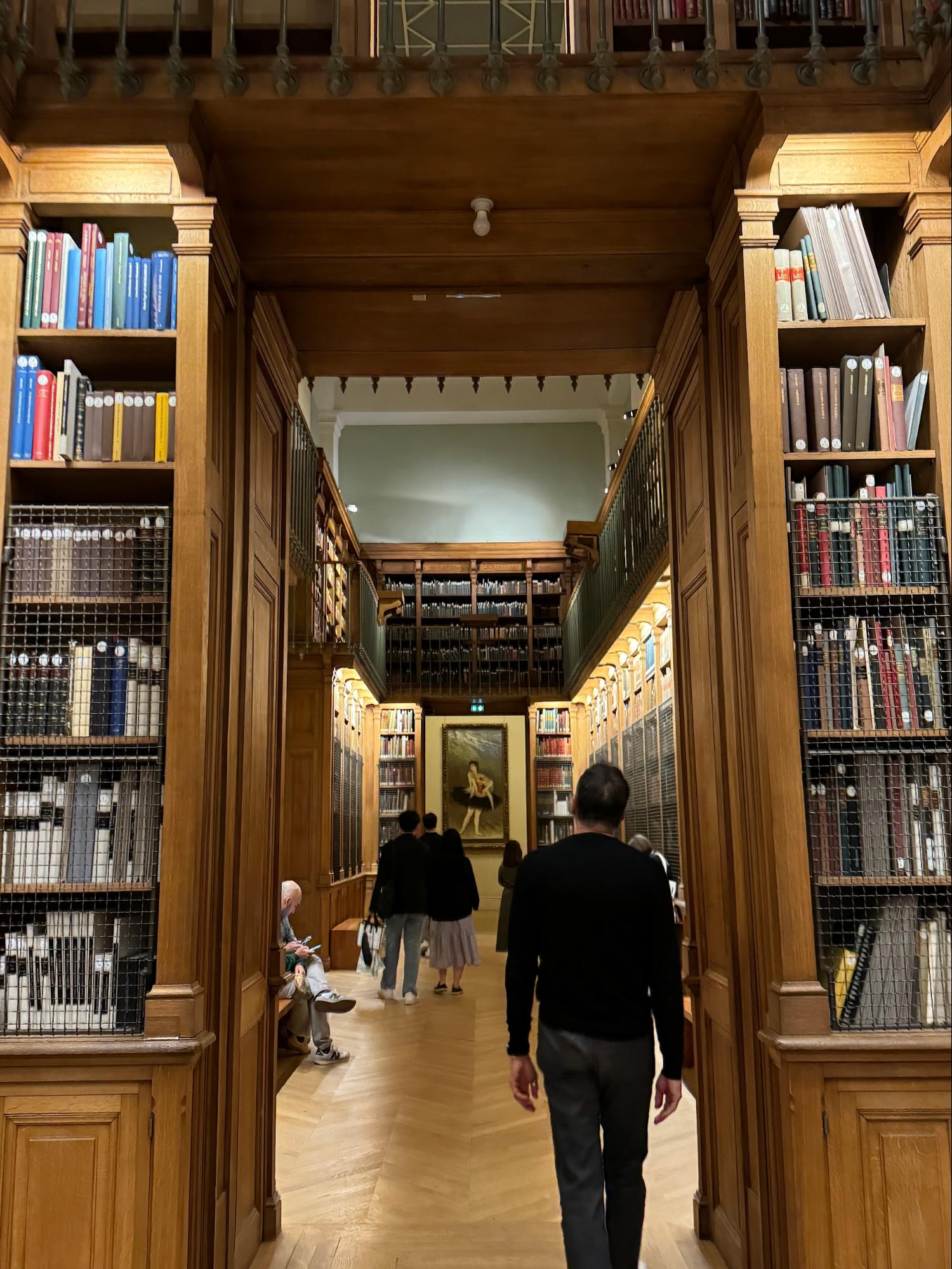 Location: Bibliothèque-Musée de l'Opéra National de Paris, Palais Garnier, Paris, France Wood Highlights: Trim at top of millwork with lighting incorporated