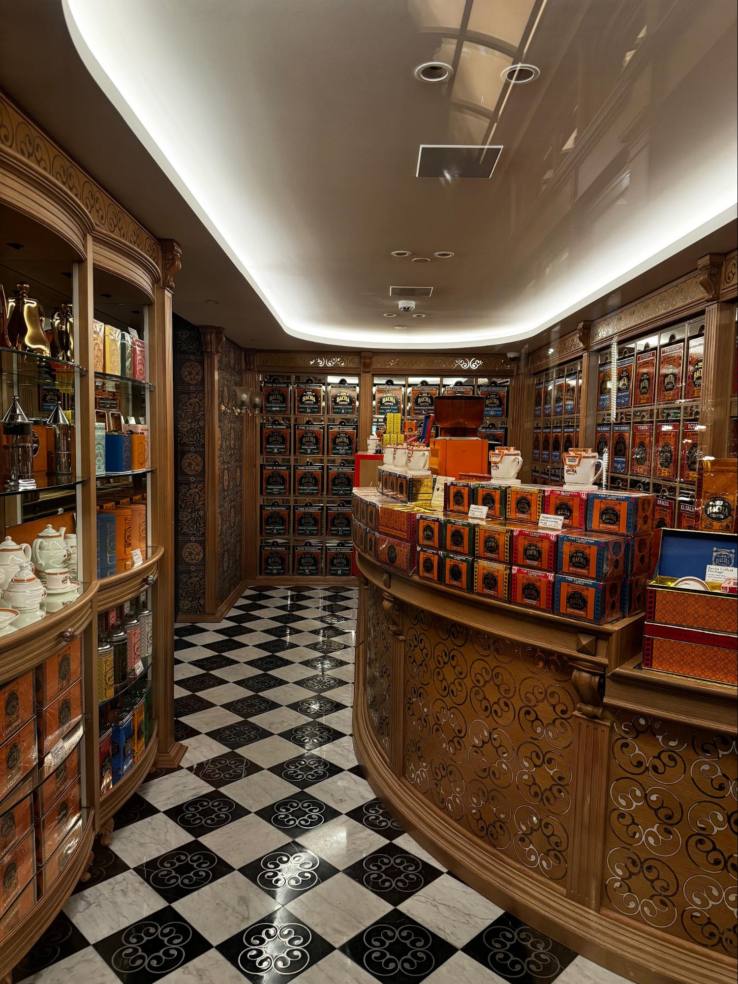 Location: Retail Shop, Paris, France Wood Highlights: Trim at ceiling placed to allow stepped ceiling and recessed lighting