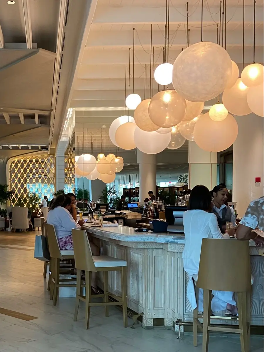 Location: Monkey Bar at SLS Baha Mar, Bahamas,Wood highlights: wood trim with moulding at bar area