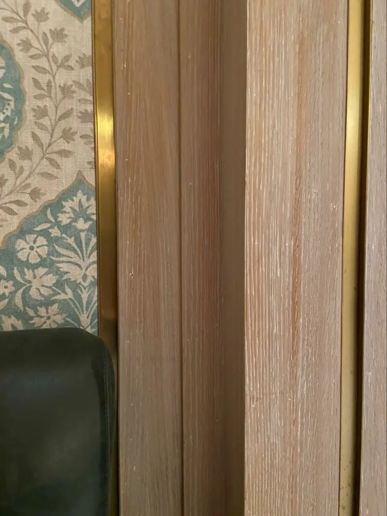 Location: Cafe Boulud, Nassau, Bahamas, Wood Highlights: Detail of architectural trim moulding paired with metall, wallcovering and leather