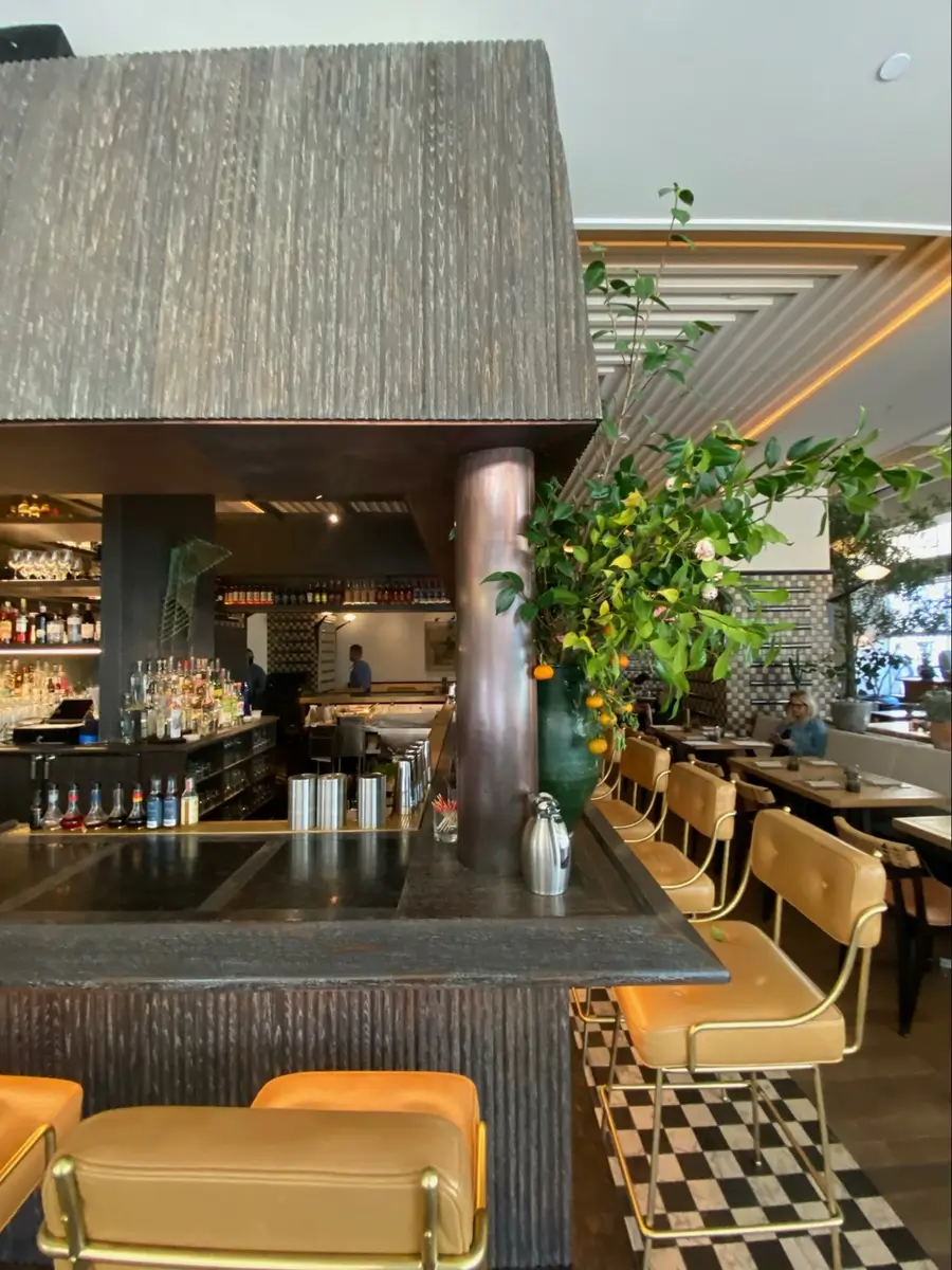 Location: Bar at Caldo Verde, L.A., California, Wood Highlights: half round wood trim at bar and upper area, with wood edge profile at counter