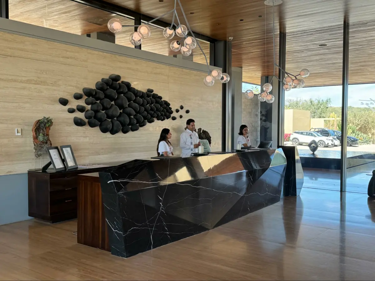 Location: The Montage Los Cabos, Baja California, Wood Highlights: Interior moulding design and architectural moulding at reception desk combined with geometric stone design