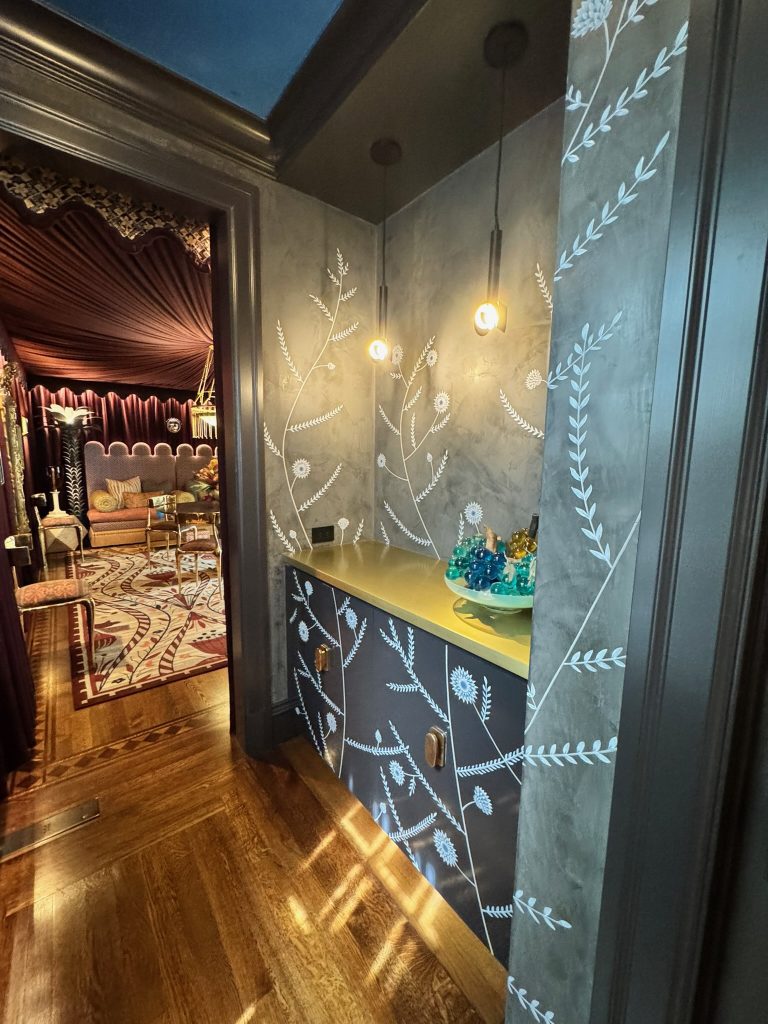 Photo credit: Metaphor Edge, Location: Private Residence, San Francisco, California, Wood Highlights: Black painted crown moulding, black painted door trim, baseboards, with a hand painted white floral motif