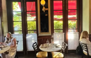 Photo credit: MetaphorEdge.com, Location: Bouchon Bistro, Yountville, California, Wood Highlights: chair rail moulding with wainscoting painted red