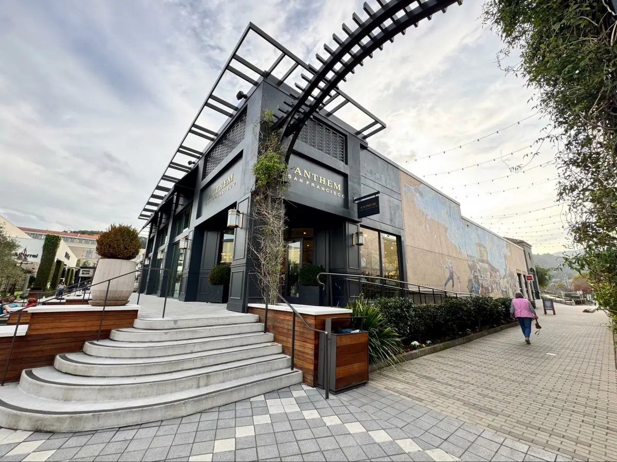Photo credit: MetaphorEdge.com, Location: Anthem, The Village, Corte Madera, California, Wood Highlights: Sleek black pergola structures extend the building’s architectural lines, adding depth to the facade while framing views of the surrounding plaza