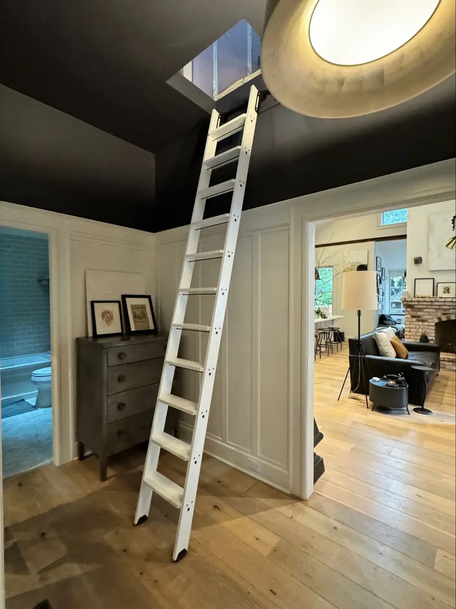 Location: Private Residence, Marin County, California, Wood Highlights: Painted picture rail moulding, S4S ladder rails, S4S ladder treads, baseboards, door frames, wainscoting, shoe moulding, cap moulding, flooring, with ladder in climbing position