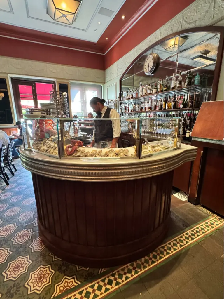 Location: Bouchon, Yountville, California, Wood Highlights: Red painted crown moulding, ogee trim, panel moulding, island trim, baseboards, mirror frame