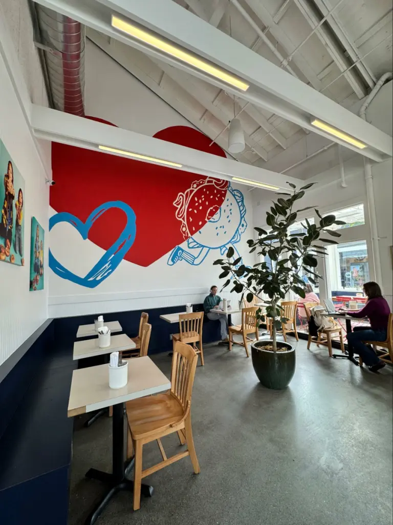 Photo credit: MetaphorEdge, Location: Loveski Deli, Corte Madera, California, Wood Highlights: chair rail moulding with wainscoting above built in seating