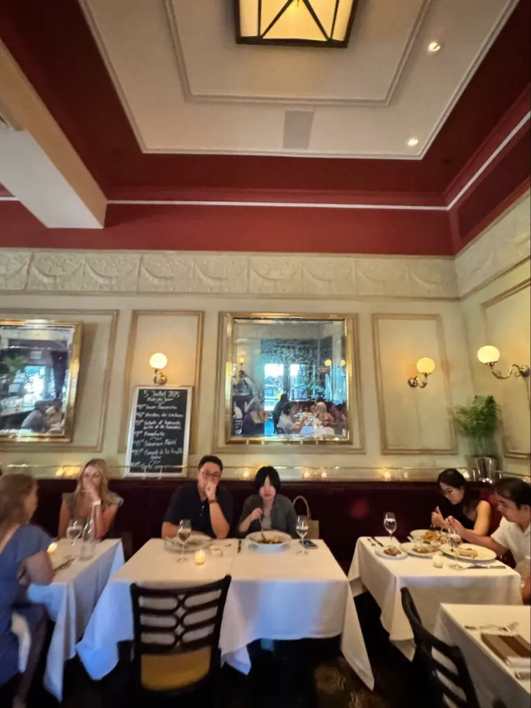 Photo credit: MetaphorEdge, Location: Bouchon, Yountville, California, Wood Highlights: Red painted crown moulding, white painted ogee trim, panel moulding, baseboards