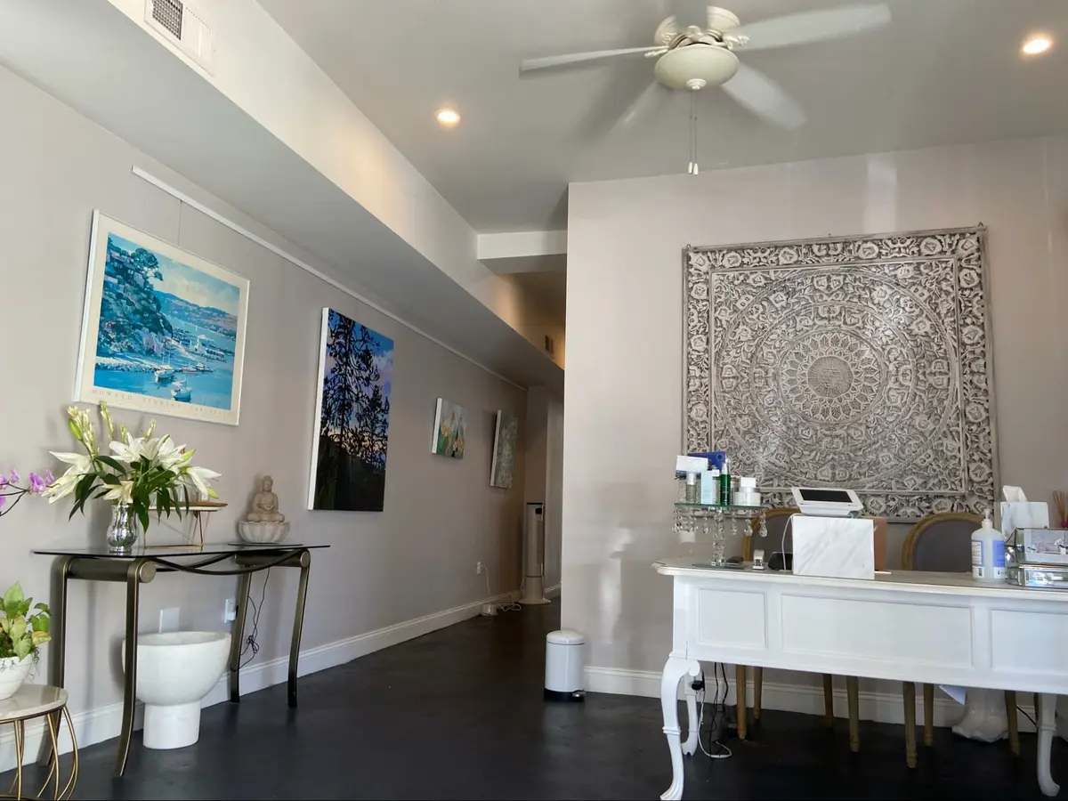 Photo credit: MetaphorEdge, Location: Ency Esthetics, Sausalito, California, Wood Highlights: picture rail moulding offers a rotating art gallery in this local spa