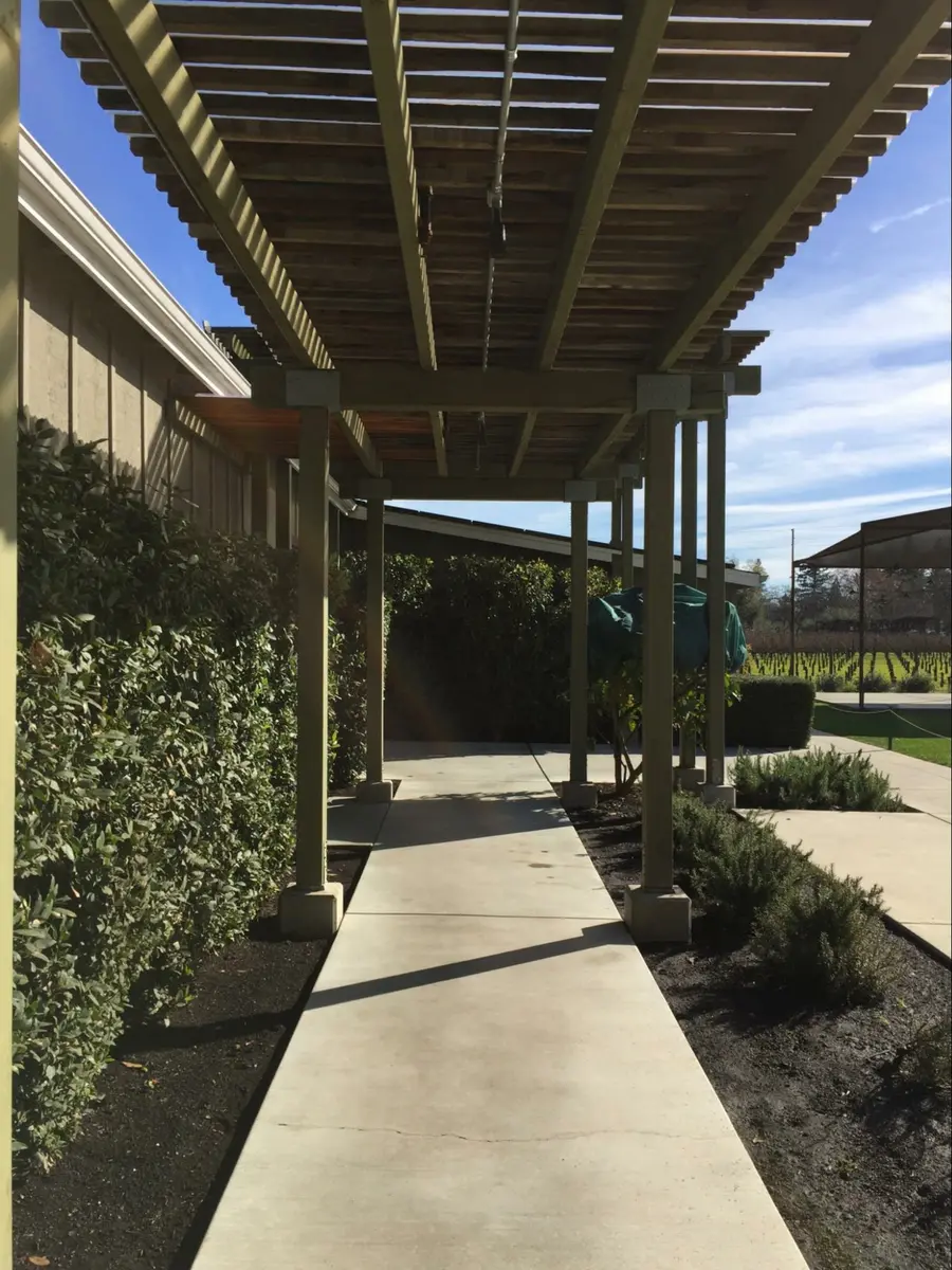 Photo credit: MetaphorEdge.com, Location: Farmstead, Napa, California, Wood Highlights: A well proportioned pergola provides shade and direction on the path