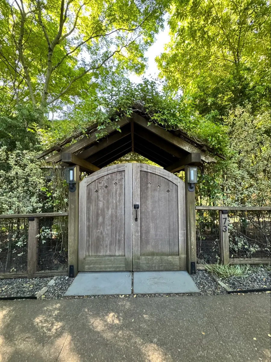 Photo credit: MetaphorEdge, Location: Private Residence, Marin County, California, Wood Highlights: Arbor at a garden gate in matching species creates a sheltered threshold that feels private yet inviting