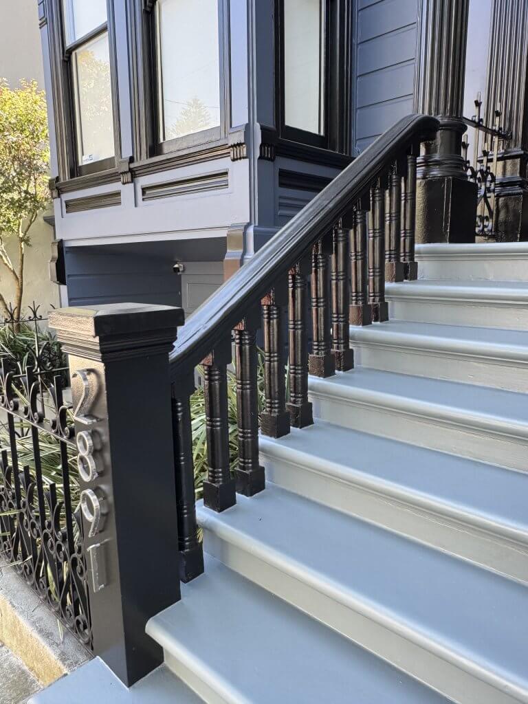 Location: Private Residence, San Francisco, California, Wood Highlights: Wide historic handrails connecting a trimmed square S4S post with an upper landing column, providing protection with architectural distinction