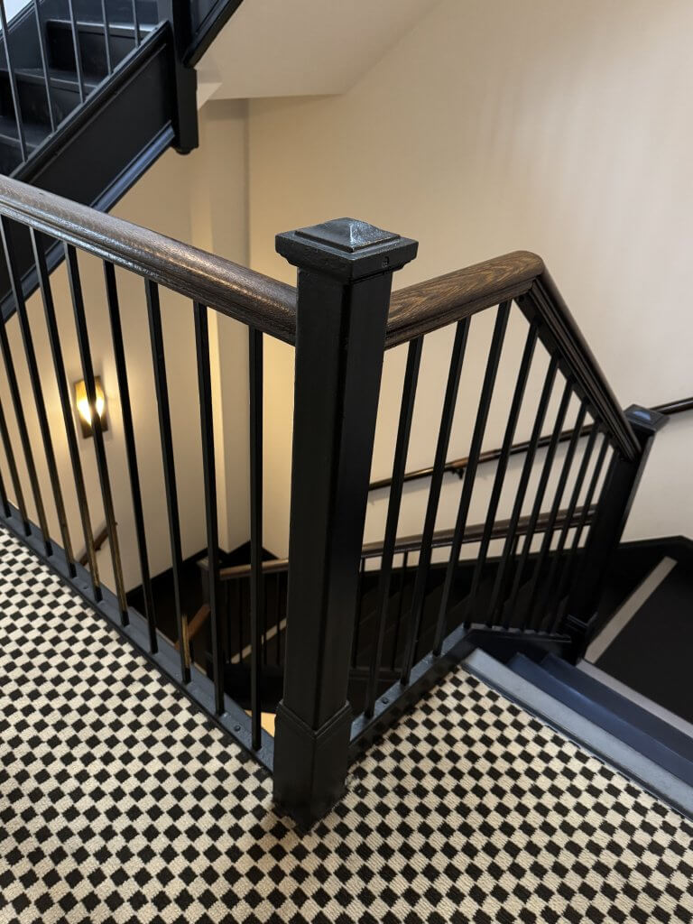 Location: The Proper Hotel, San Francisco, California, Wood Highlights: interior handrails provide a warm contrast with chestnut stained wood against metal pickets