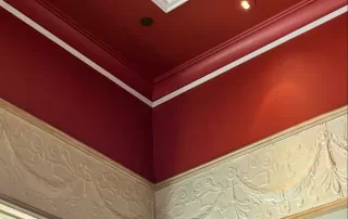 Location: Bouchon, Yountville, California, Wood Highlights: Red painted crown moulding, ogee trim, panel moulding