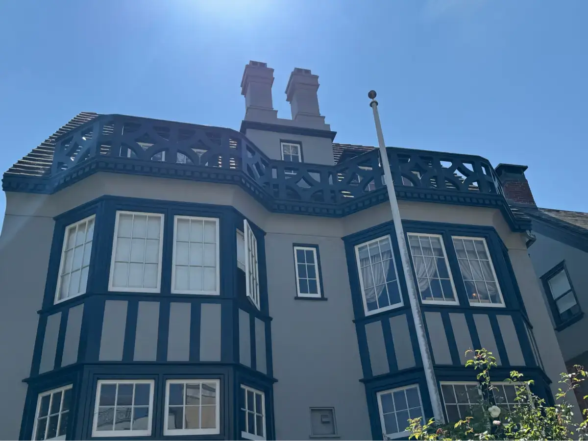 Location: San Francisco, California Wood Highlights: Boldly painted wood stucco moulds define bays and gables, with decorative balcony railing above. Contrasting trim creates shadow lines and architectural depth.