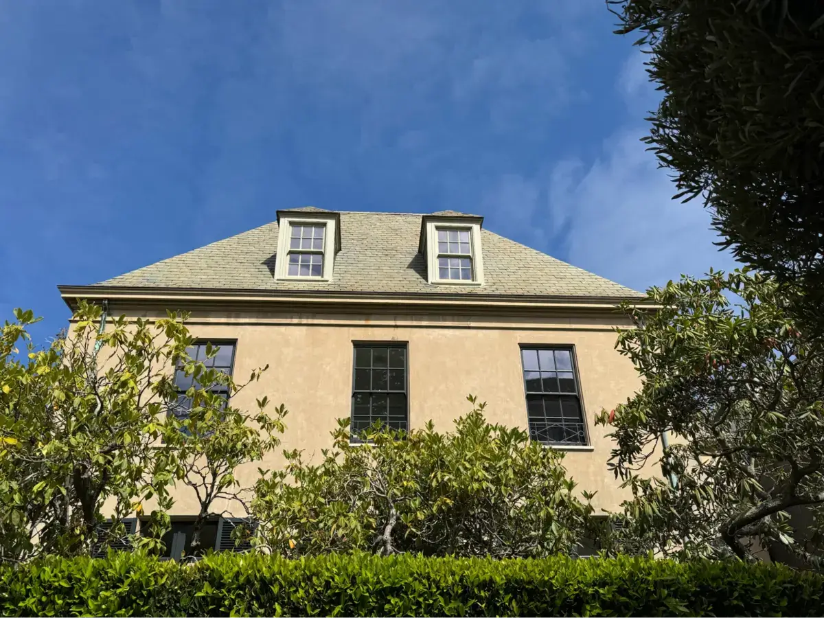 Location: San Francisco, California Wood Highlights: Smooth stucco walls with subtle mouldings emphasize proportion and rhythm. Stucco moulding profiles at the dormers and eaves add durable definition while maintaining the home’s French-inspired balance.