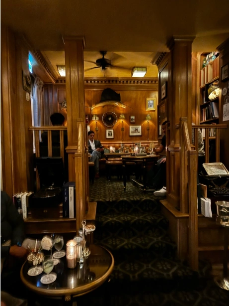 Photo credit: MetaphorDesign.comLocation: The Hemingway Bar, The Ritz Hotel, Paris, France Moulding Highlights: Wall paneling, cornice moulding, wood stair railings, wall cap, trim at banquette seating, baseboards, wood trim at columns