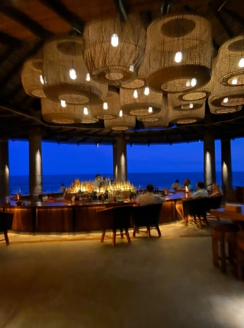 Photo credit: MetaphorDesign.comLocation: Palapa, Esperanza Hotel, Cabo San Lucas, Baja California, Mexico Moulding Highlights: Wood moulding trim below counter, wood clad beams