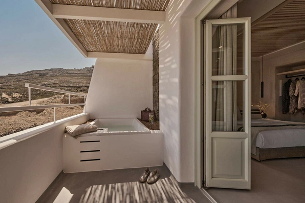 Location: Yi Hotel, Mykonos, Greece Wood Highlights: Wood door casing to match wood doors for this minimalist yet warm design
