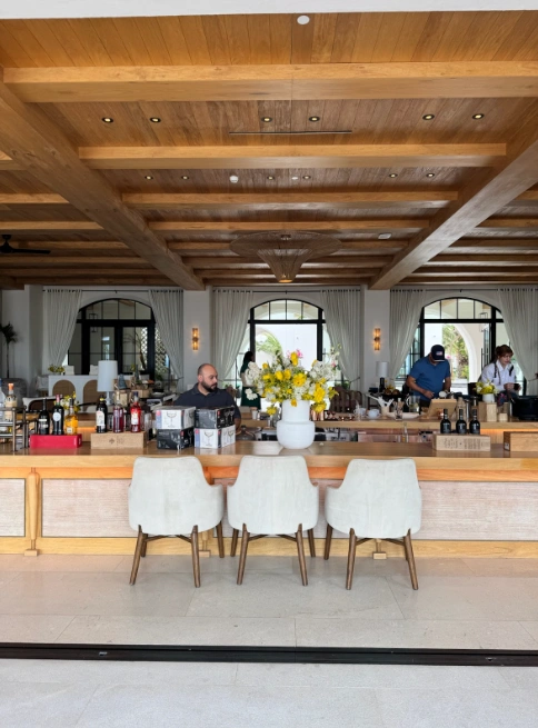 Photo credit: MetaphorDesign.comLocation: Lobby Island Bar, The Four Seasons, Cabo San Lucas, Mexico Moulding Highlights: Wood baseboard, trim at island, wood tongue & groove ceiling, trimmed wood beams 