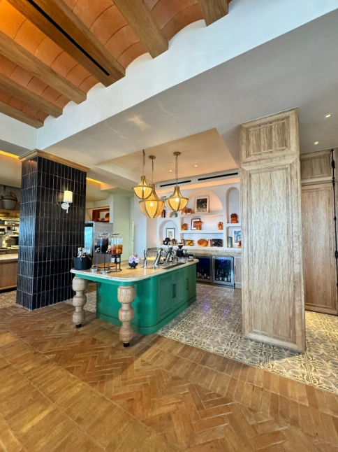 Photo credit: MetaphorDesign.com Location: Service Island, The Four Seasons, Cabo San Lucas, Mexico Moulding Highlights: Wood baseboard, painted wood trim at island, wood clad ceiling beams, wood trim at end panel, wood cornice at top of column, wood trim at panelling