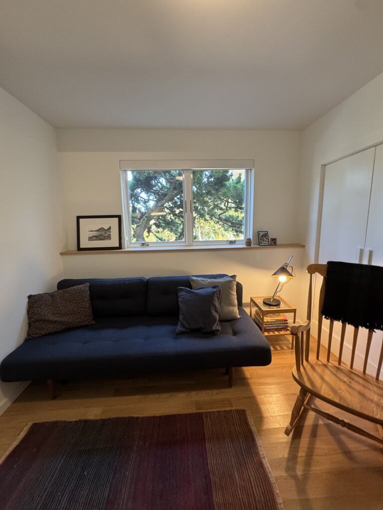 Location: Grandmother’s House, San Francisco, California, Wood Highlights: a contemporary wall cap extends the window sill to the full width of the room, protecting it from wear and providing a convenient ledge while picking up on the color and finish of the T&G wood flooring, in contrast to the painted white baseboards below