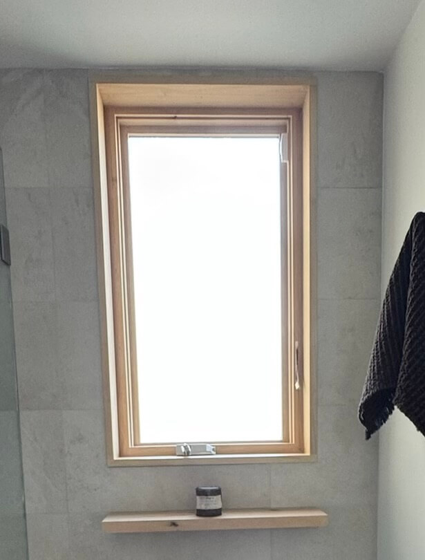 Location: Grandmother’s House, San Francisco, California, Wood Highlights: contemporary window trim and sill design, S4S floating shelving in a second bathroom in matching natural wood species provides a contrast to the cool-hued hard surfaces in this room