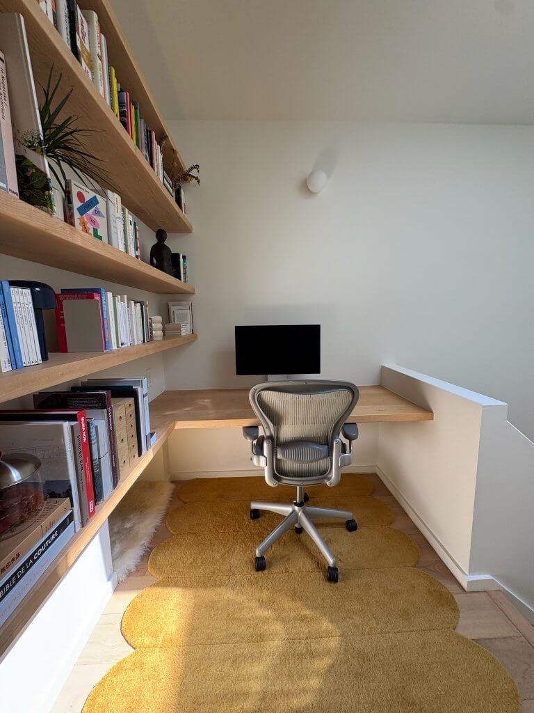 Location: Hayes Valley House, San Francisco, California, Wood Highlights: S4S milled shelving, wide plank white oak floors, modern painted baseboards in the loft home office makes efficient and elegant use of the upper stair landing on the AIASF Home Tour