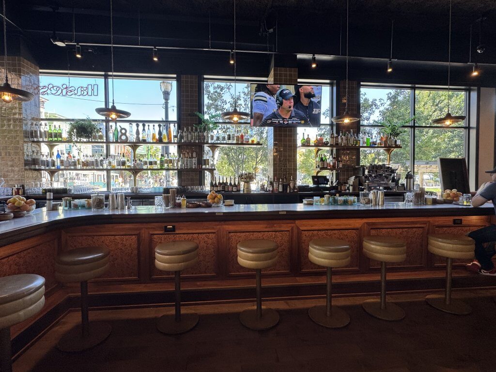 Location: Hazie’s Restaurant, San Francisco, California, Wood Highlights: A warm wood counter edge with trimmed panels below and a brass footrail in this Hayes Valley neighborhood restaurant artfully sets the stage for conversation among guests.