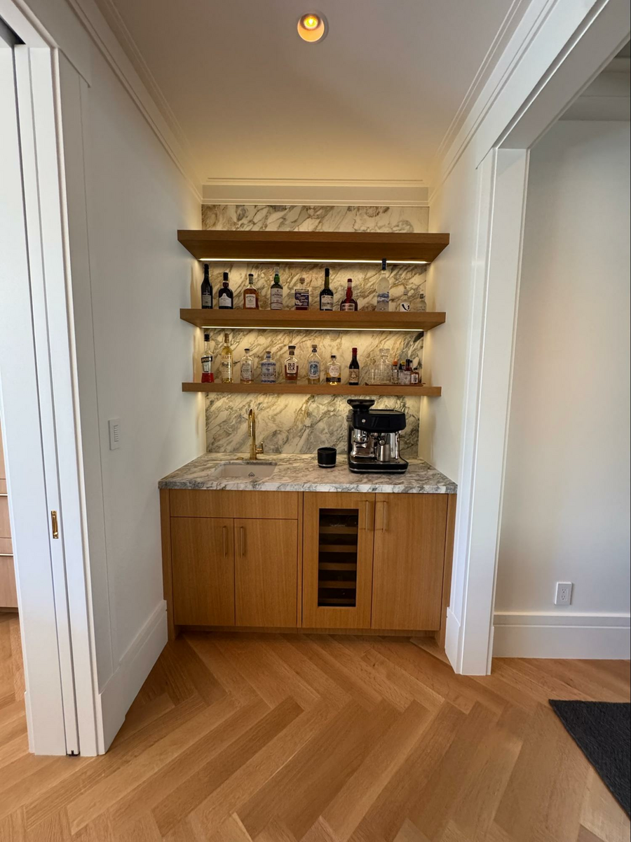 Location: Eureka Valley Home, San Francisco, California, Wood Highlights: this corner alcove surrounded by unique trim in the dining area serves sophisticated style as a bespoke moment to make drinks for the family and guests