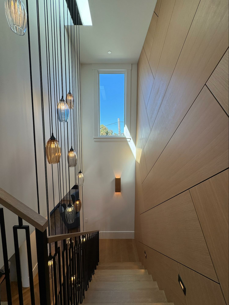 Location: Eureka Valley Home, San Francisco, California, Wood Highlights: AIASF Home Tour stair area by Gast Architects comes together with custom wood handrails, stair treads, risers and landing flooring, baseboards and window trim, all coordinated to stand out or recede in a harmonious composition