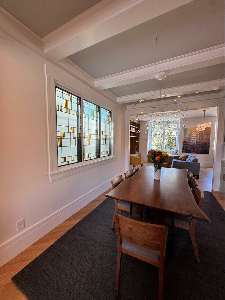 Location: Eureka Valley Home, San Francisco, California, Wood Highlights: Dining room features a custom stained architectural glass panel, a contemporary interpretation of Victorian craft, set within traditional wood trim details, bringing warmth, artistry and fresh light diffusion.