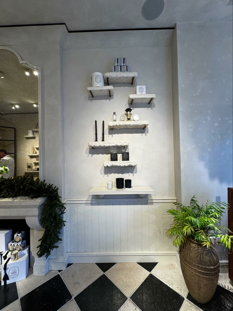Wood Highlights: White lacquer wainscotting adds to the luxe feel of this Pacific Heights perfumery, a subtle departure from the chalky matte wall treatment above, calm yet dimensional.