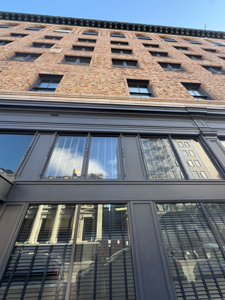 Location: San Francisco, California, Wood Highlights: Exterior window casings on a historic commercial facade in San Francisco’s Mid-Market district, where wood, brick, and masonry must withstand fog, air movement, and long-term moisture exposure.