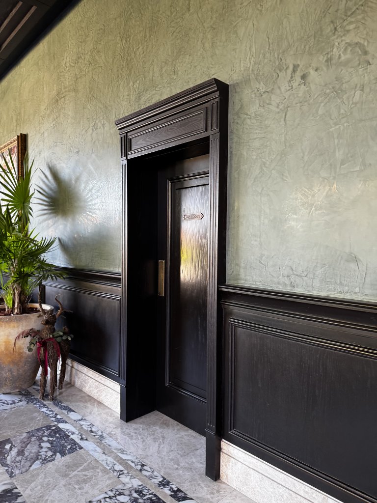 Location: Hospitality project Wood Highlights: Custom door casings offer proportion and dramatic uniqueness